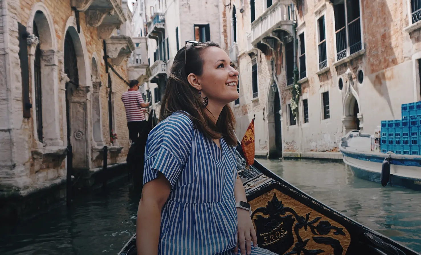 Girl in boat with building around